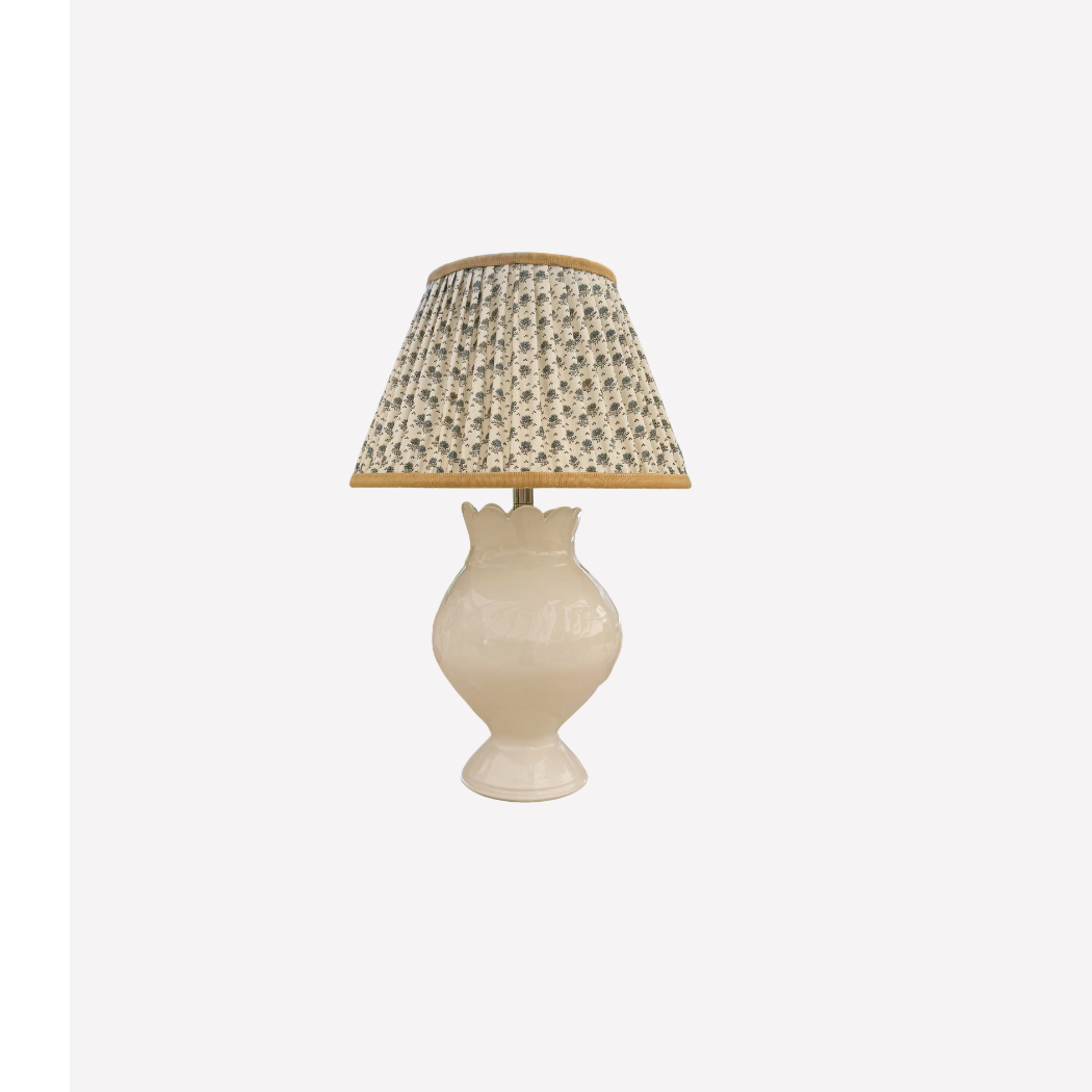 Table lamp with a decorative shade on a white background